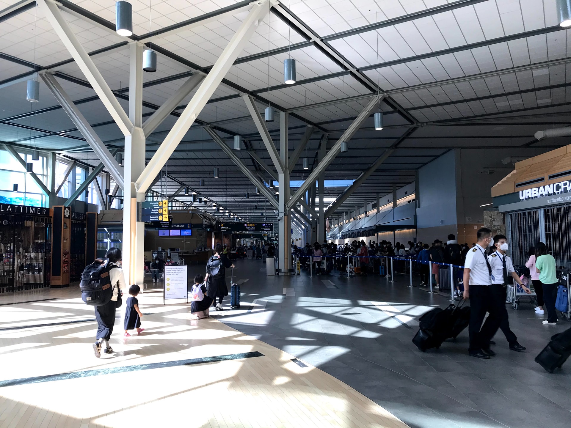 People walking inside of Vancouver AIrport