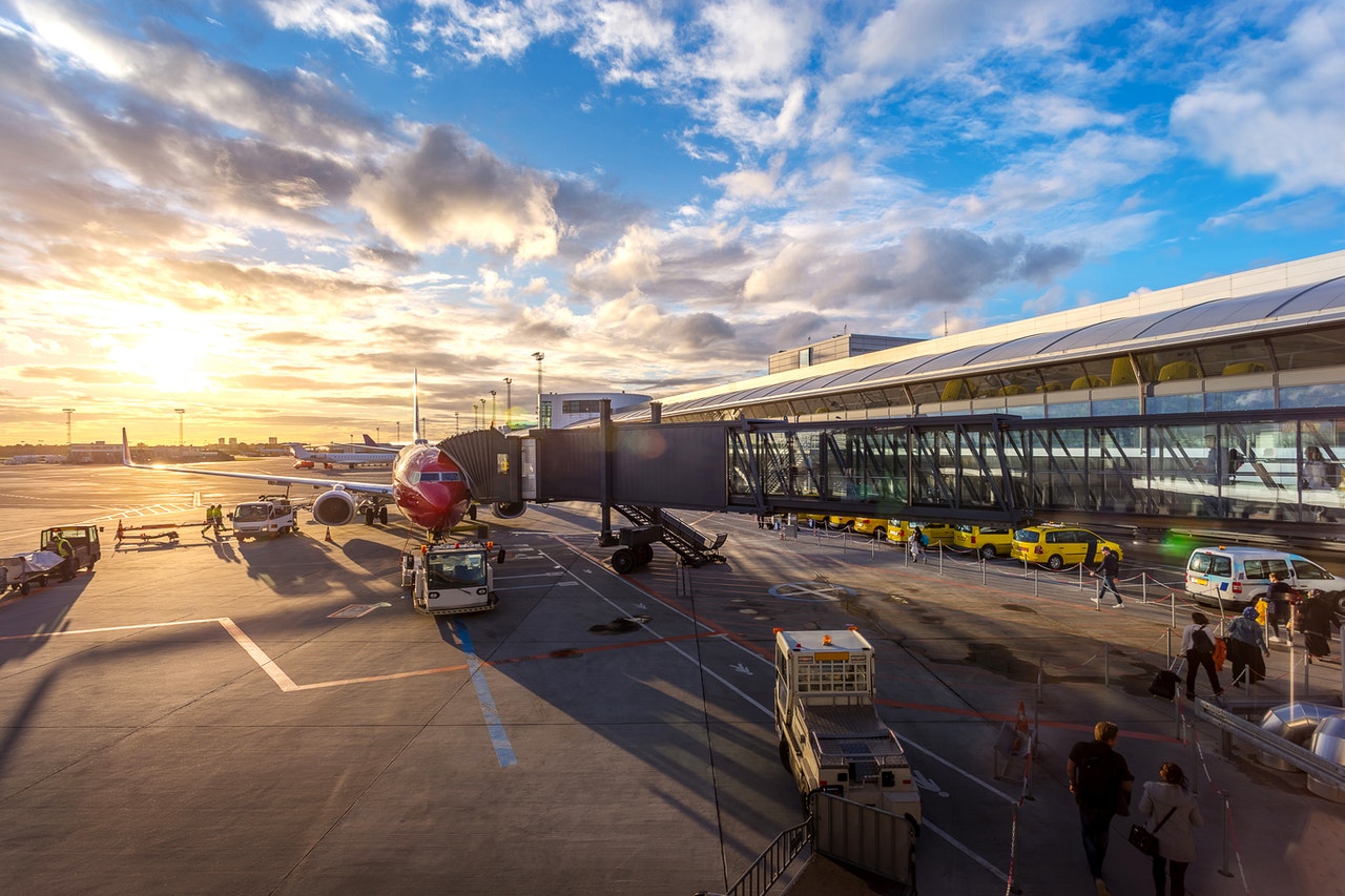 Airplane docking at an airport terminal.