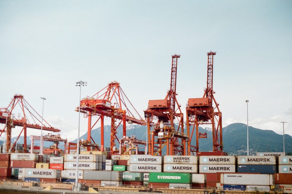 A series of containers and container cranes in Vancouver.