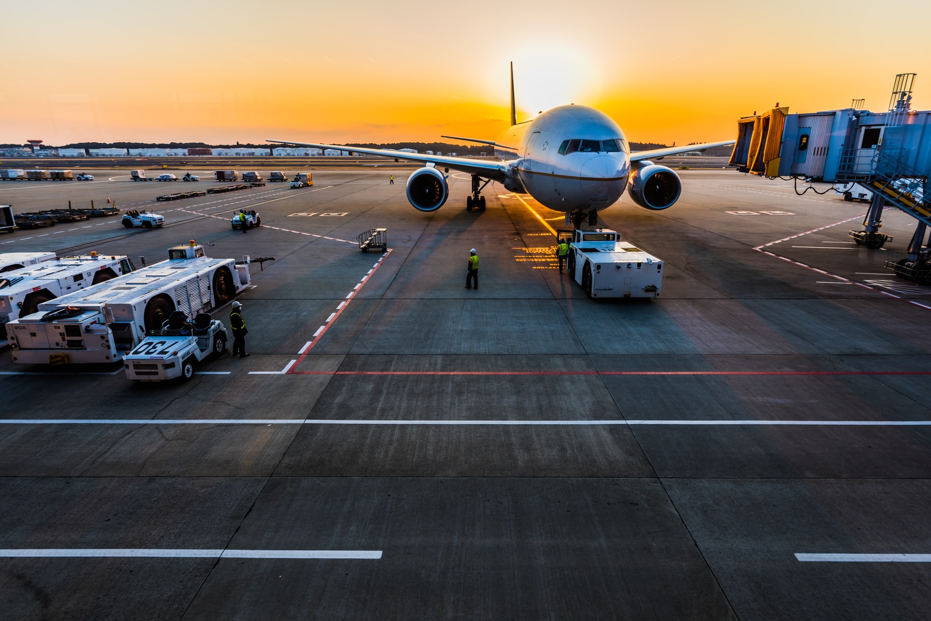 Front of a plane at an airport gate